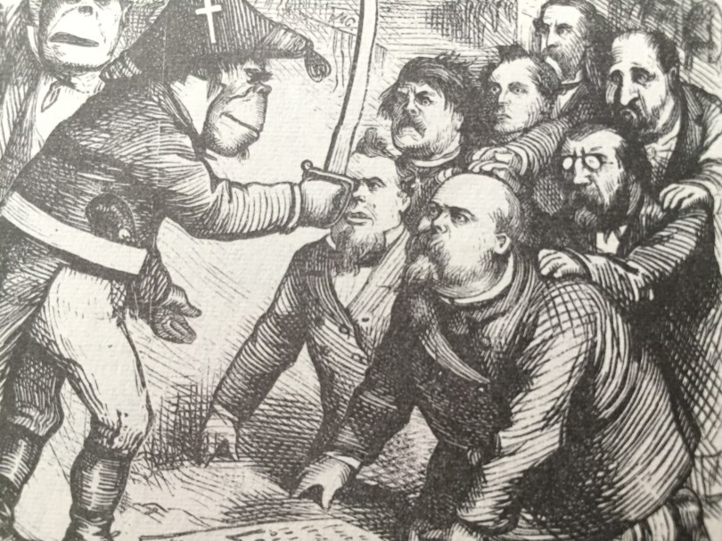 An ape-like Irish Soldier raises a sword as Tweed and cronies kneel cowering